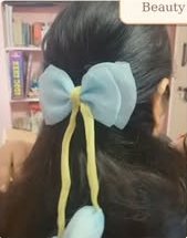 Blue organza bow worn in hair
